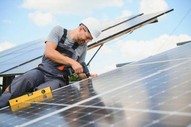 istock Worker installing solar panels outdoors 1452327890
