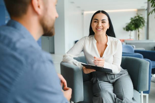 istock Depression Counseling. Desperate Man Telling About Unhappy Life While Professional Psychologist Taking Notes During Appointment In Office. Selective Focus 1452329779