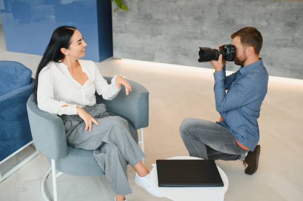istock Young beautiful model posing for professional photographer in studio. 1452329977