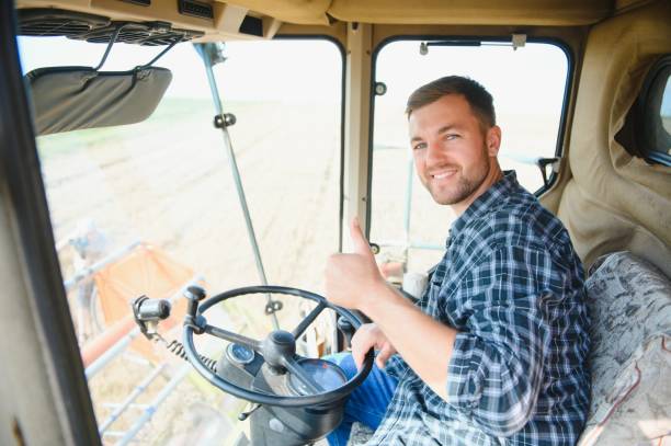 istock Farmer controls the combine harvester. 1452333353