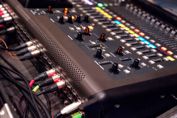 istock Instrument audio jack connectors inserted into channels on a mixing desk in a recording studio. 1452334219