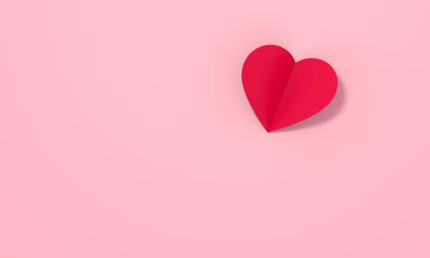 istock Heart cut out red on pink background. 1452334308