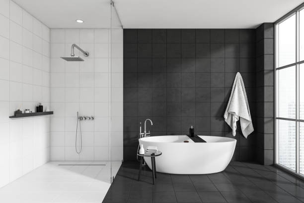 istock Front view on dark bathroom interior with bathtub, shower 1452336237