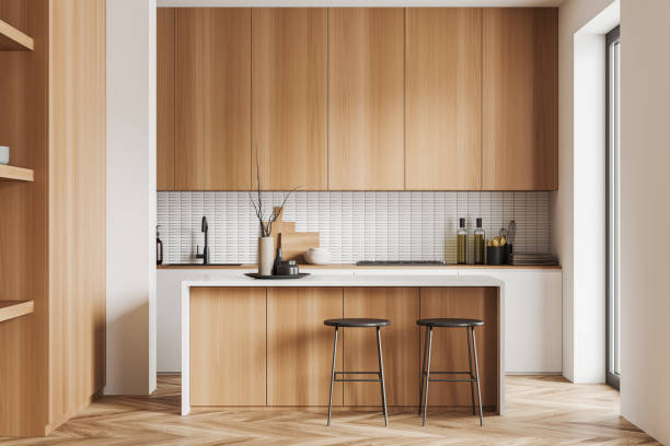 istock Light kitchen interior with bar countertop and seats, cooking space 1452336323