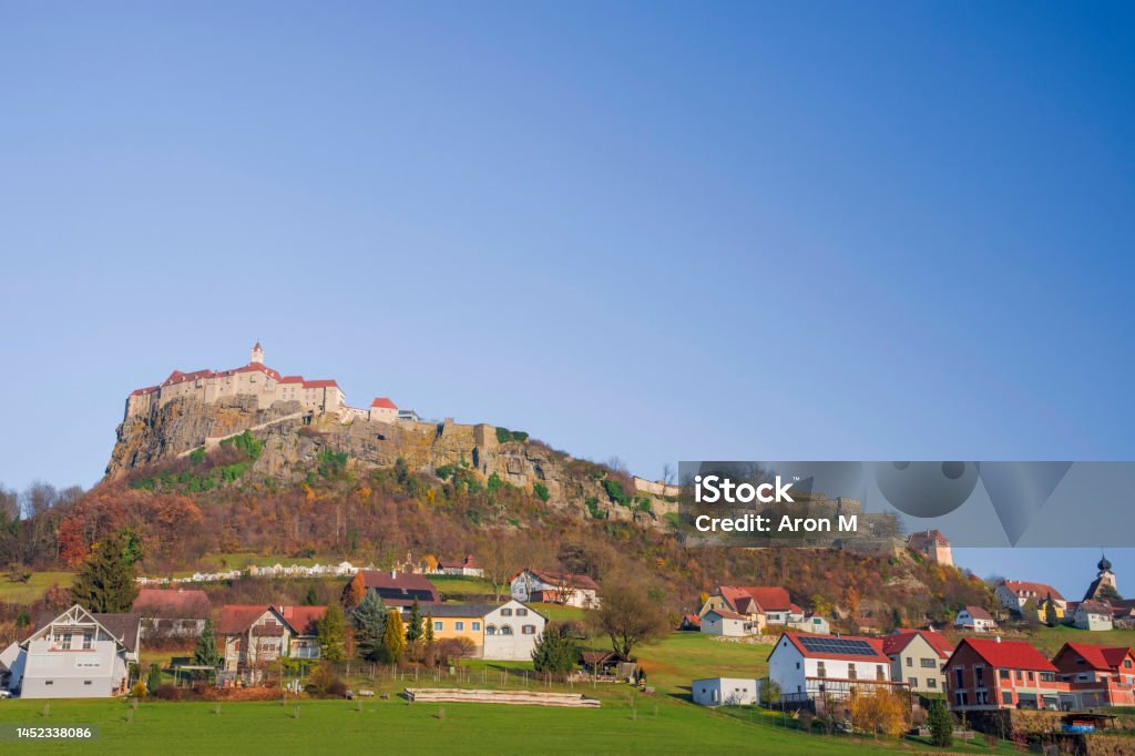 The medieval Riegersburg Castle on top of a dormant volcano, surrounded by charming little village and beautiful autumn landscape, famous tourist attraction in Styria region, Austria Ancient Stock Photo
