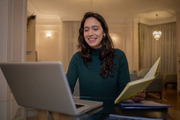 istock Young woman working from home 1452338383