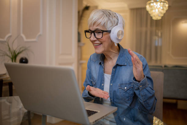 istock Senior woman working from home 1452338425