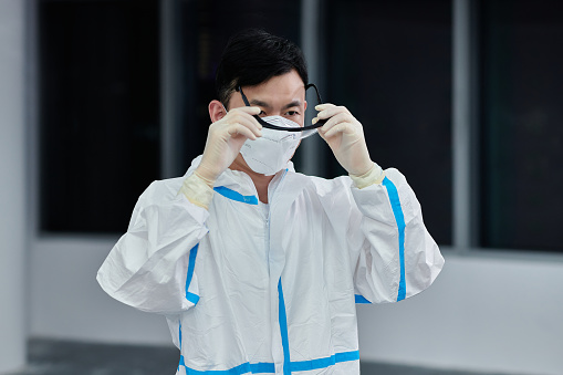 Close-up of one asia male doctors is wearing at protective eyewear.