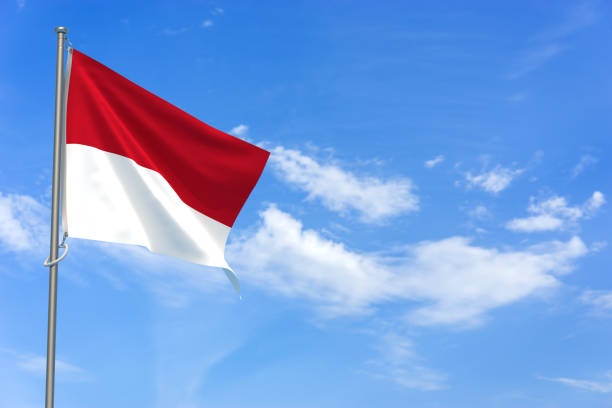istock Principality of Monaco Flags Over Blue Sky Background. 3D Illustration 1452342601