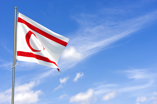 Turkish Republic of Northern Cyprus Flags Over Blue Sky Background. 3D Illustration