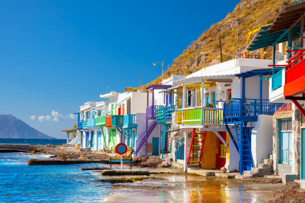 Vibrant fishing village of Klima with white houses and colorful doors on Milos Island in Greece Vibrant fishing village of Klima with white houses and colorful doors on Milos Island in Greece. High quality photo fish village stock pictures, royalty-free photos & images