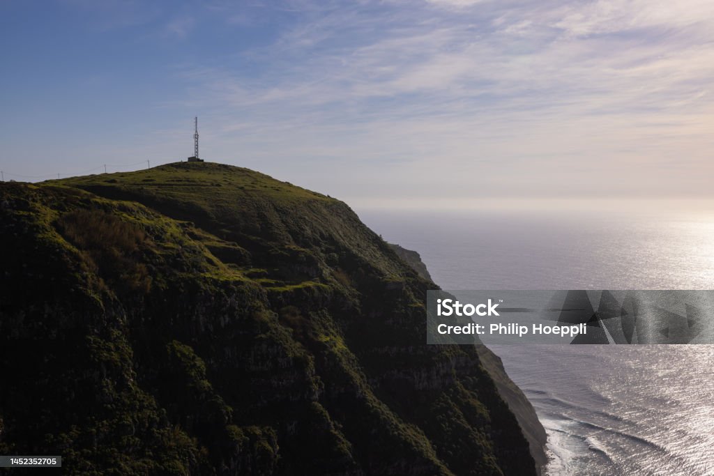 Amazing lighthouse on a high cliff on the Madeira coast in Portugal. Wonderful landscape in Portugal, Madeira. Aerial View Stock Photo