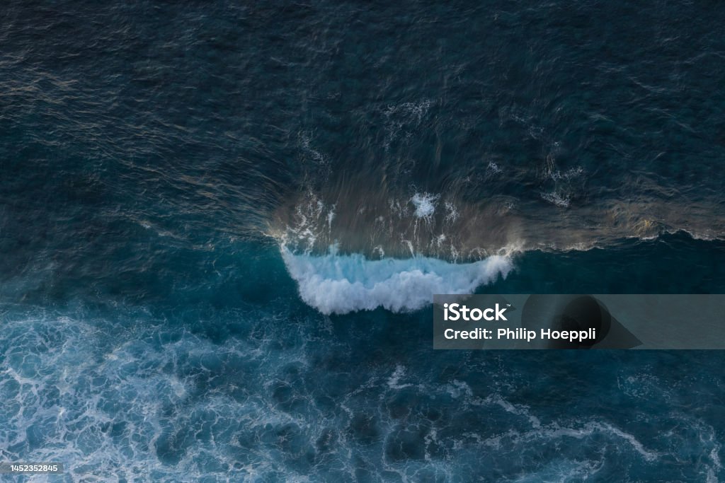 Very big waves off the coast of Morocco in the Atlantic Ocean on a beautiful evening. Wonderful landscape in Portugal, Madeira. Aerial View Stock Photo