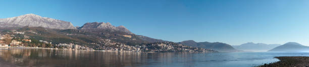 istock Autumn seascape harbor surrounded by mountains under blue sky wide panorama 1452357269