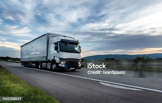 istock White Truck on the highway 1452358527