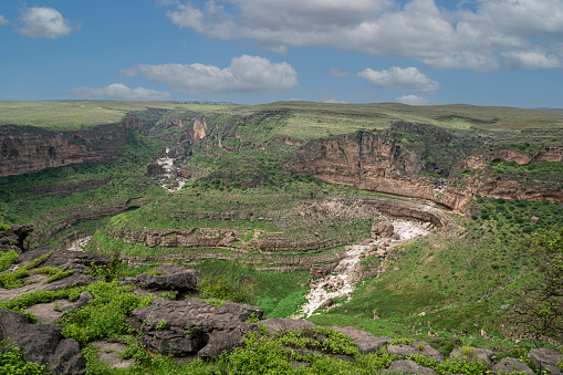 Tayq sinkhole (sometimes known as Taiq cave) is one of the largest sinkholes in the world formed when the limestone was eroded by underground rivers so that the upper layer collapsed into the void leaving the sinkhole.