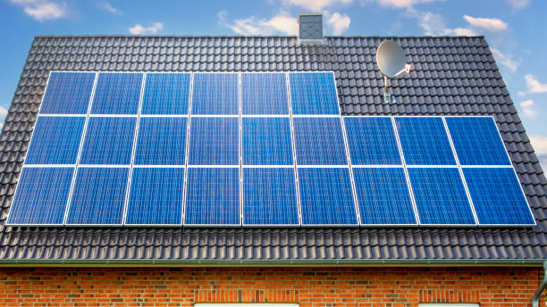 istock Old family houses modernized with solar panels on the tile roof 1452361243