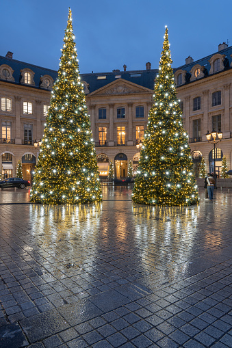 Place vendome. View of the place with christmas tree and decoration in a rainy night