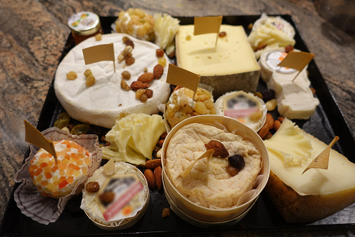 Platter of various French cheeses  Goat and cow milk cheeses  French culture  Buffet meal