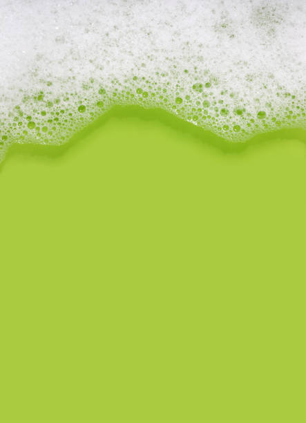 Soap suds background (green) with copy space stock photo
