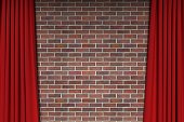 istock background of red brick wall with open red velvet theatre curtains 3d render 1452363215