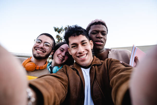 istock Happy diverse friends taking selfie 1452368216