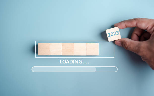 istock Hand putting wooden cube block for loading progress from 2022 to 2023 to countdown merry christmas and happy new year concept. 1452370197