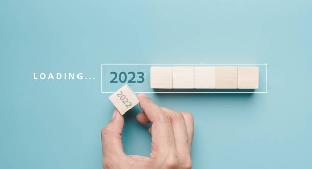 istock Hand putting wooden cube block for loading progress from 2022 to 2023 to countdown merry christmas and happy new year concept. 1452370203