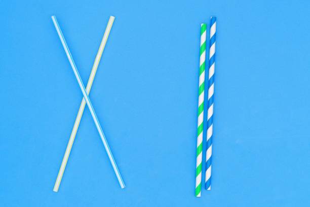 istock Plastic straw. Plastic pollution is harmful to marine life. Environmental concept. Ban single-use plastic campaign. Use of recyclable cardboard straw. 1452371090