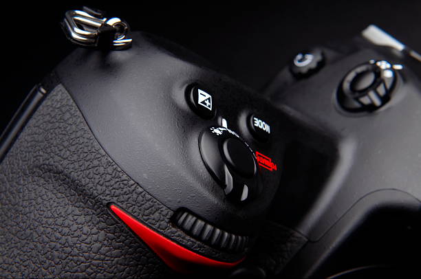 istock Professional digital photo camera with zoom lens on black background 145237128