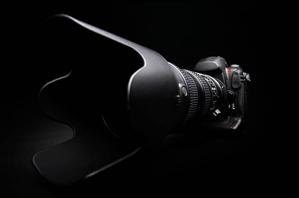istock Professional digital photo camera with zoom lens on black background 145237135
