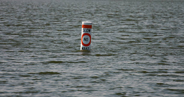 Slow no wake buoy stock photo