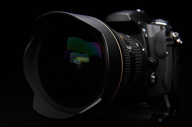 istock Professional digital photo camera with zoom lens on black background 145237156