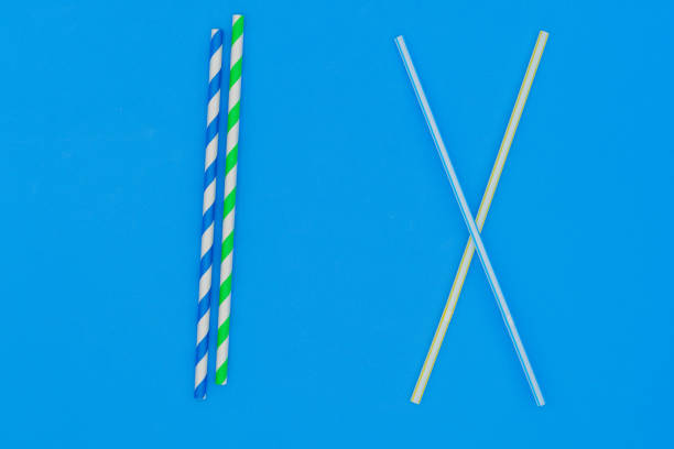 istock Plastic straw. Plastic pollution is harmful to marine life. Environmental concept. Ban single-use plastic campaign. Use of recyclable cardboard straw. 1452371849