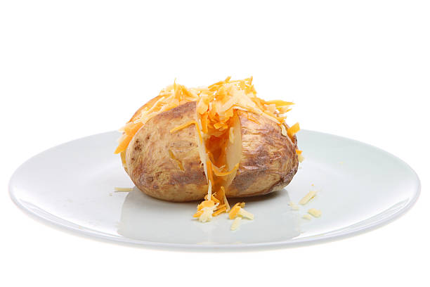 Baked potato with melting butter, horizontal.