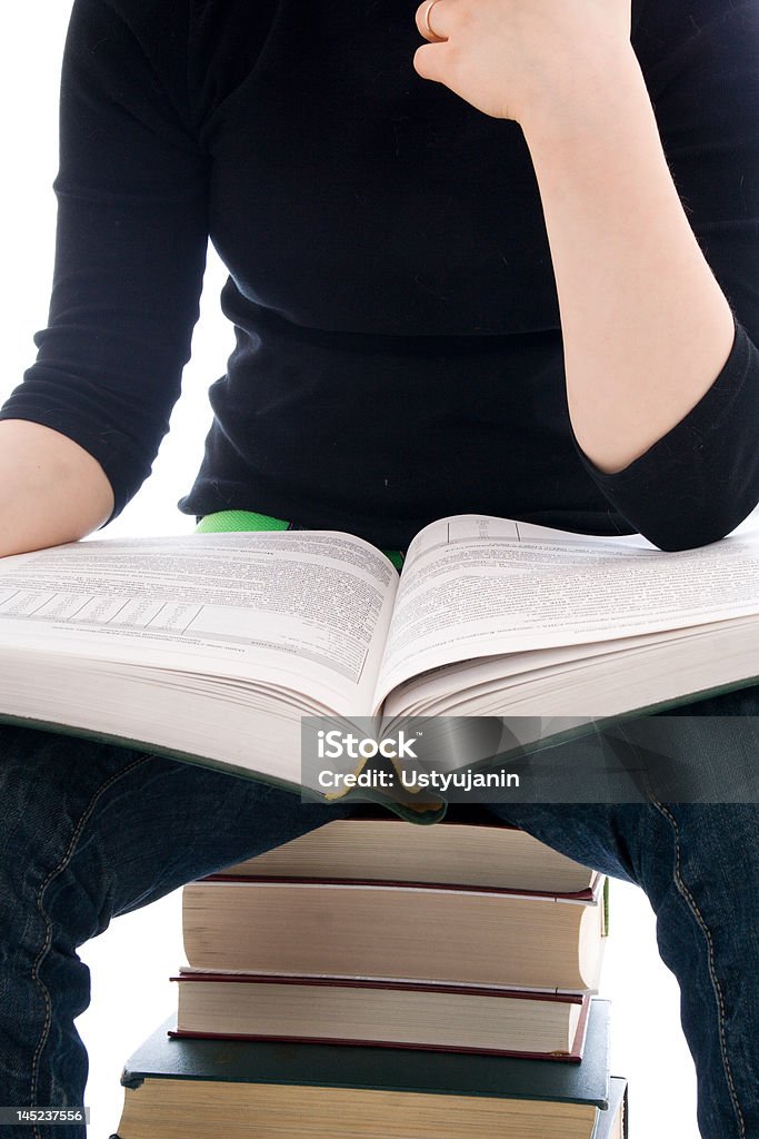 La joven estudiante con libro aislado sobre un blanco - Foto de stock de Leer libre de derechos