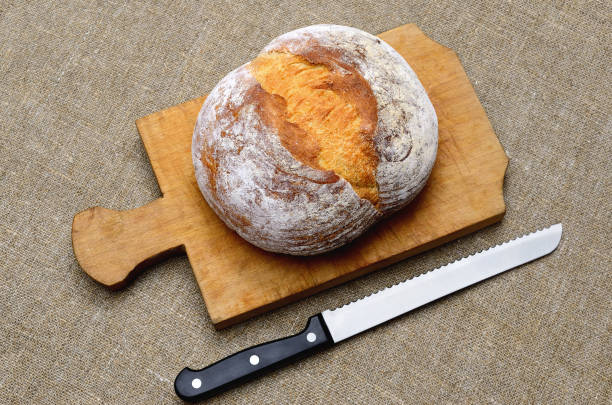 istock Fresh bread on a cutting board. Bakery products close up 1452375769