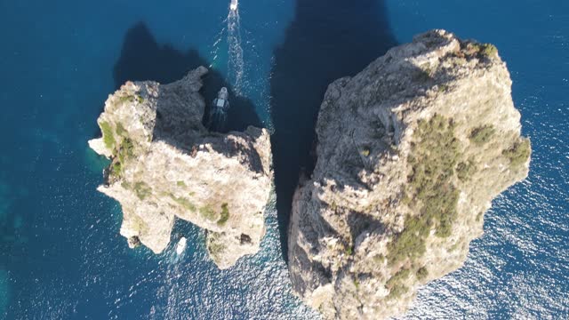 Amazing aerial view of famous Faraglioni Rocks in Capri, Italy