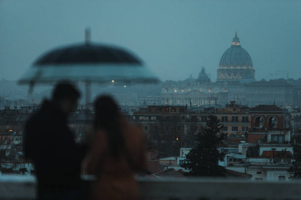 istock Melancholic Rome with rain and tourist 1452384384