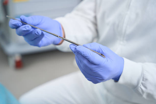 istock Man holds in his hands tool for installing pellets to patients 1452387958