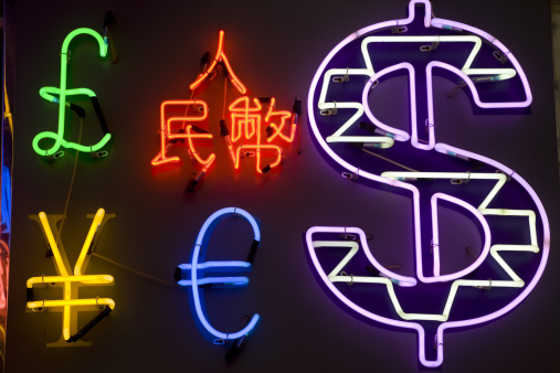 Neon signs in the shape of various currencies
