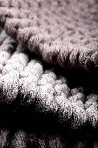 istock Knitted fabric as background. Knitted textured background. Selective focus. 1452389095