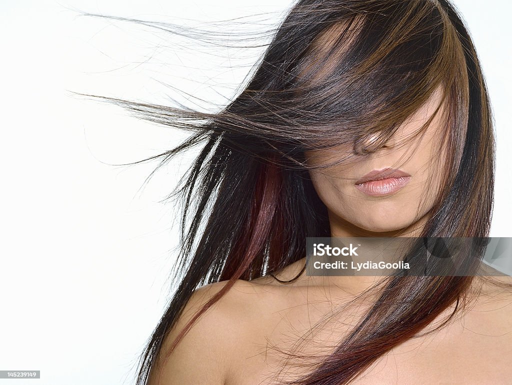 Blown away Woman with long hair blowing in her face. 20-29 Years Stock Photo