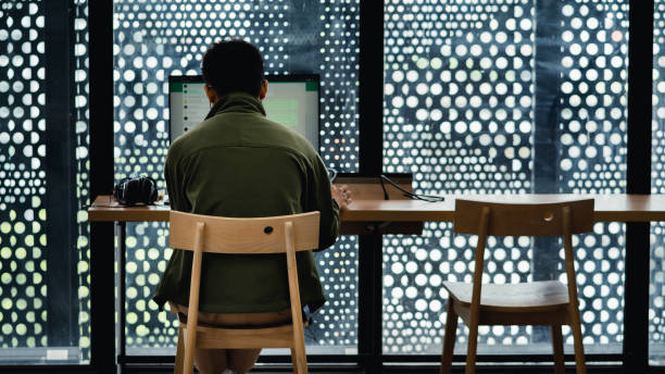 Jakarta, Indonesia - October 2022 : a man uses whatsapp on a computer belonging to the jakarta library.