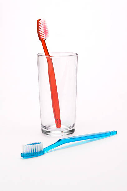 Red and blue toothbrushes stock photo