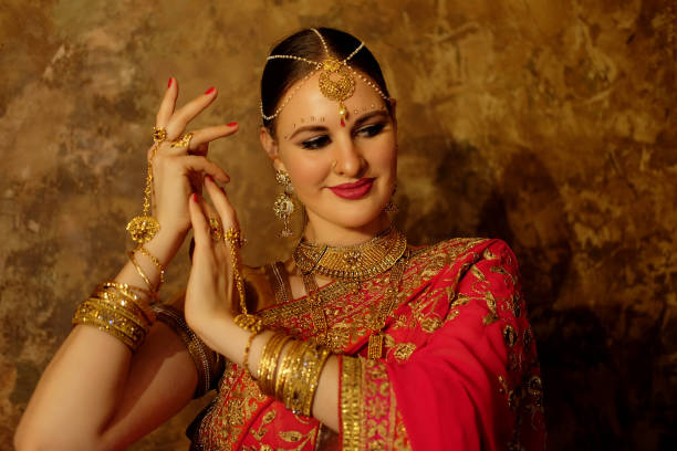 istock Beautiful indian woman dancer in red sari. 1452396253
