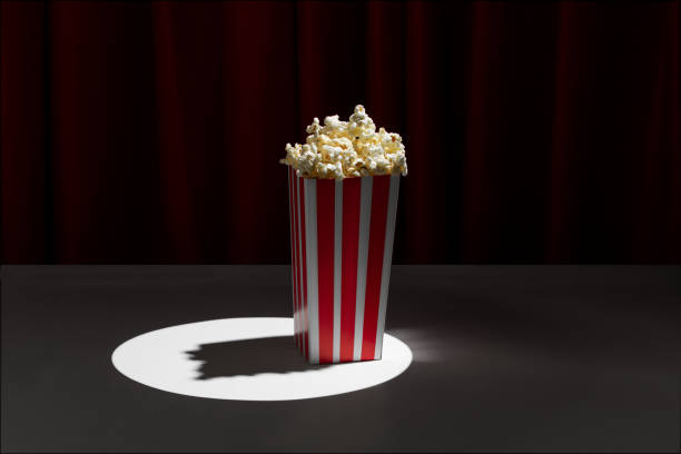 istock popcorn box on theater stage with red curtains 1452397202