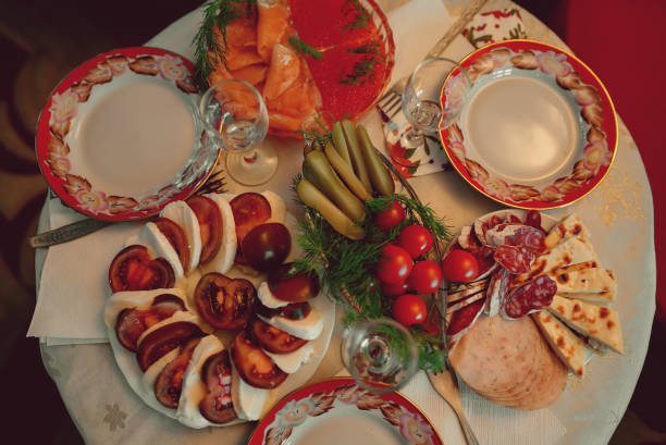 istock Russian New Year's table. Red fish, caviar and pickles for vodka. 1452397801