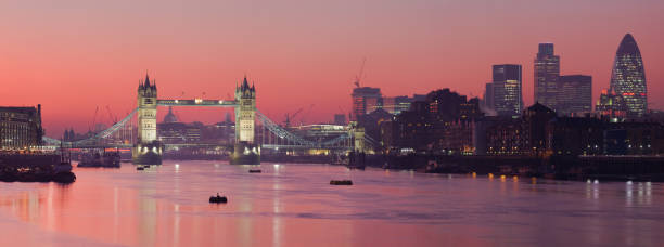 Tower Bridge and city of London with deep red sunset stock photo