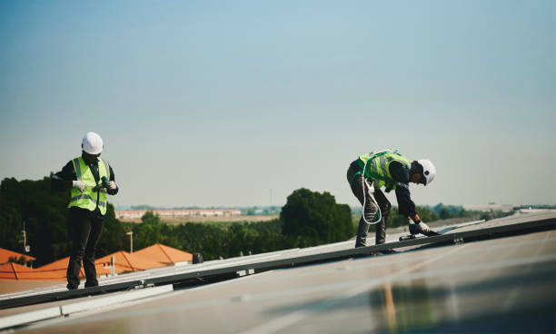 istock Engineer installs solar energy system working on high-rise building roof. 1452406170
